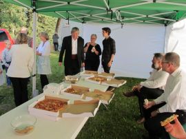 Volunteers enjoy pizza before they start work